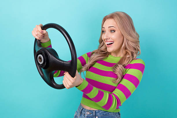 istock Photo of funky excited lady wear striped pullover driving automobile looking empty space isolated teal color background 2212869126