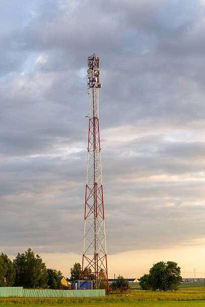 istock Sunset over rural farmland with cell tower 2212869456