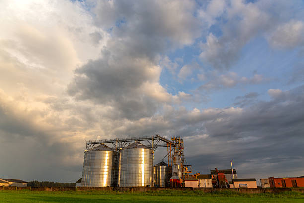 istock A captivating sunset over a grain dryer and hopper 2212869457
