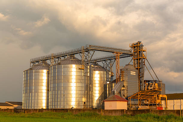 istock A captivating sunset over a grain dryer and hopper 2212869458