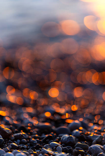 Sparkles of light on the beach at sunset