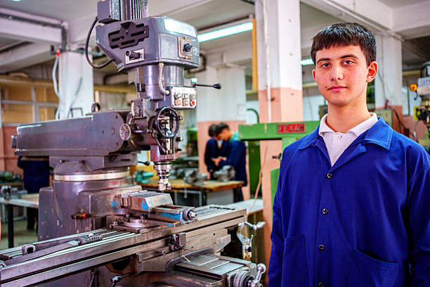 istock Teenage Student Standing Next to Milling Machine in Workshop 2212871213
