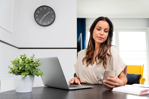 istock Attractive, beautiful woman using smartphone 2212871806