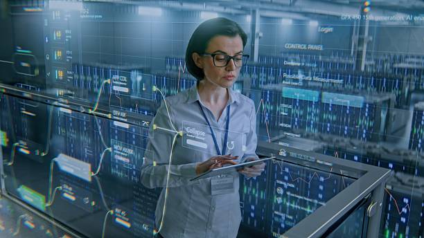 istock Big Data Center: Female Specialist Using Tablet Computer. Animated Charts of Internet Traffic on Servers 2212872487