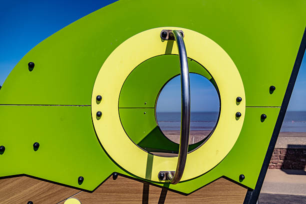 Sea view through playground climbing frame in Minehead