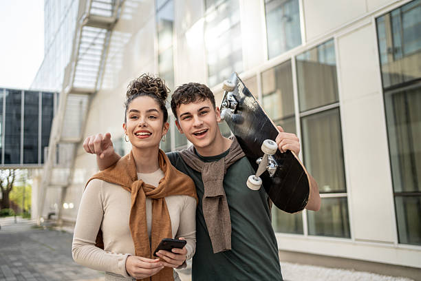 istock Young students with skateboard planning their day together 2212877334