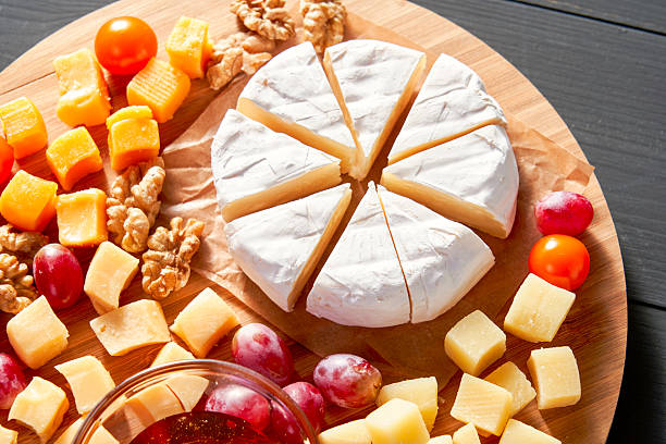 istock A cheese platter with a wedge of cheese missing 2212879705