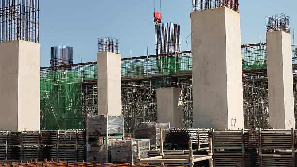 istock construction site with tower crane and reinforced concrete columns on-going construction 2212886012