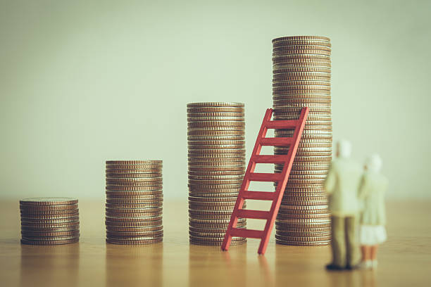 istock Old senior couple person standing looking at growth stack coins graph chart and red ladder. 2212886934
