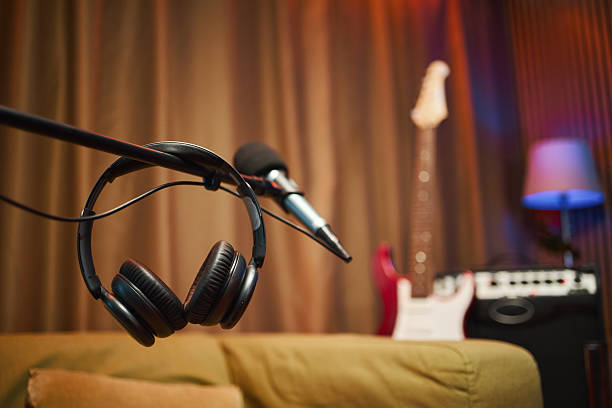 Close-up of microphone with headphones in recording studio