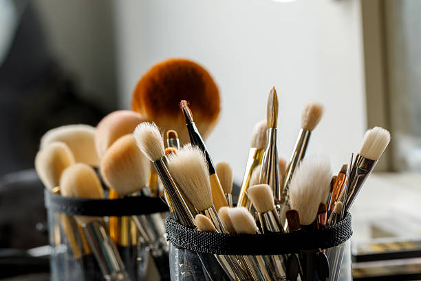 istock Makeup brushes in a leather pouch, various sizes and shapes, ready for use. A mix of bristles poking out. 2212896979