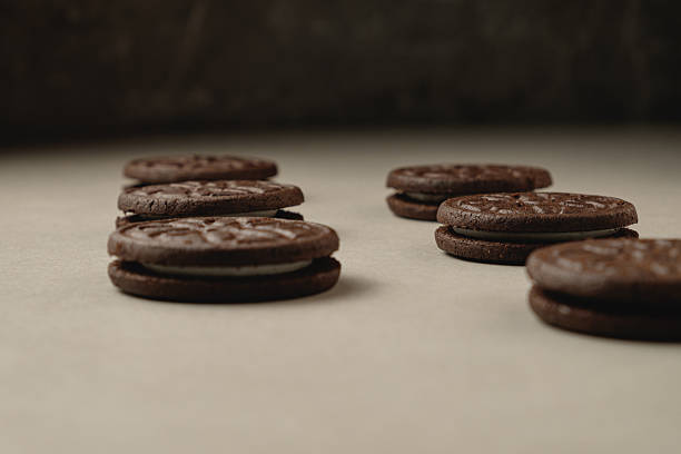 istock Decadent chocolate cookies arranged on a rustic surface at golden hour 2212900230