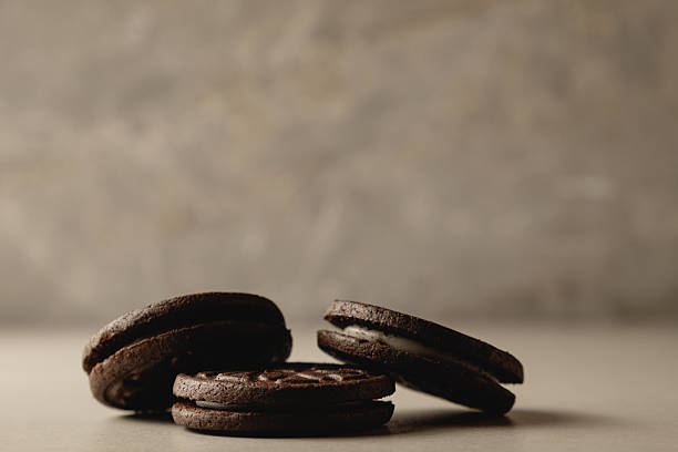 istock Delightful chocolate cookies resting on a smooth surface in soft lighting 2212900313