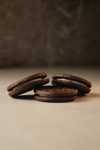 istock Delighting in rich chocolate cookies on a minimalist table 2212900325