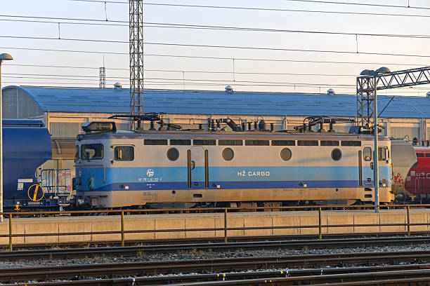 Slavonski Brod, Croatia - October 22, 2024: Croatian Railway Hz Cargo Locomotive at Train Station Sunny Morning.