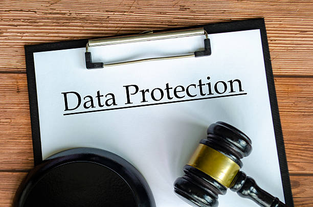 istock Data Protection text on white paper clipboard with gavel 2212904589