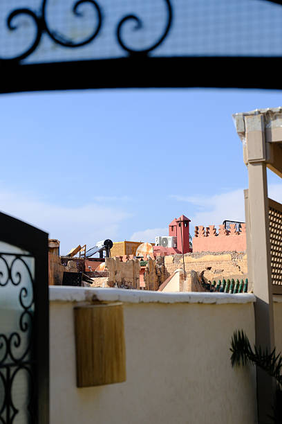istock A view over the rooftops of Marrakesh with authentic old and crumbling buildings, Riads, Chimneys and towers. 2212905833