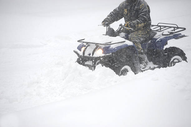 man removing snow driving snowplow