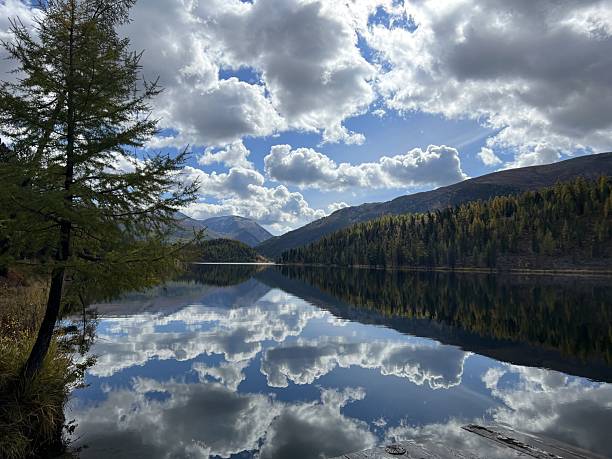istock Serene autumn landscape with reflections in altai mountains capturing tranquil nature scene and cloudy sky 2212907245