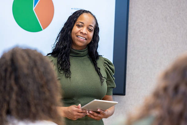 istock Women Build Project Timeline in Conference Room 2212908168
