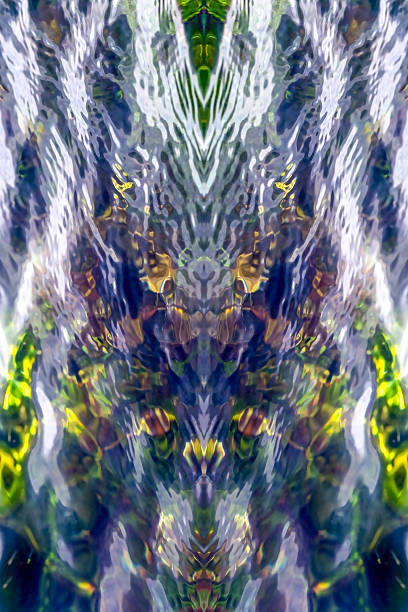 istock Cold colors. Abstract background.Whimsical glare and reflections, algae and stones under transparent water. symmetrical vertically 2212909668