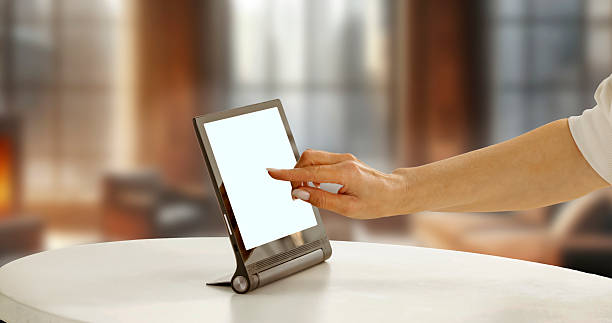 istock Close-up of woman's hand touching tablet screen while online browsing e-commerce website and online stores. Concept of online shopping, e-commerce, mobile payment and modern digital lifestyle. 2212910798