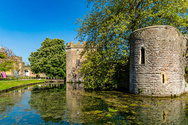 Bodiam Castle in East Sussex reflected in moat water below, UK, 23 April 2011.