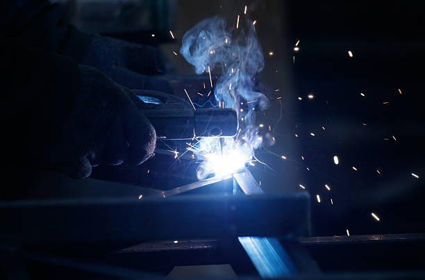 istock A man is welding metal with a bright blue flame 2212911479