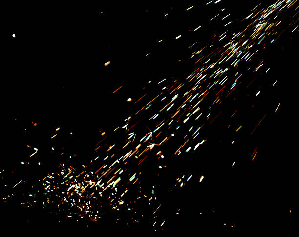istock A black background with a lot of sparks and fire 2212911642