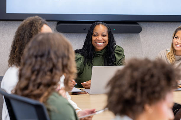 istock Women Share Expertise in Office Boardroom Session 2212912433