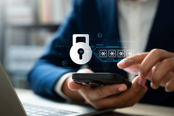 istock Businessman using smartphone to encrypt data and strengthen cybersecurity, Protecting personal and corporate information against hackers. Data privacy, Safe internet technology practices. 2212915599