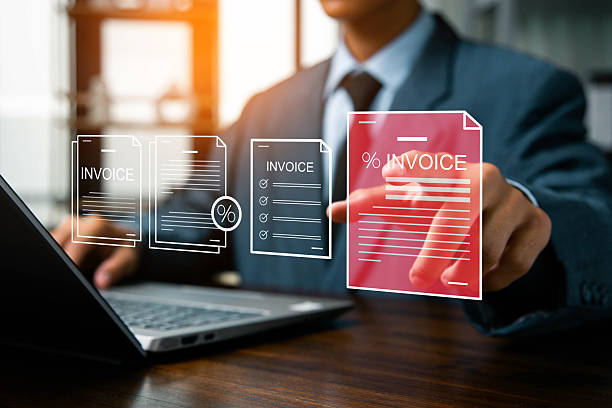 istock E-Invoice and Digital billing concept, Businessman using laptop to manage electronic statements on virtual screen. E-tax, Digital receipt, Online invoice processing and tax accounting solutions. 2212915690