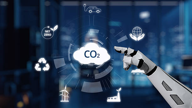 istock Futuristic Robot Hand Interacting with Digital CO2 Emission Reduction Symbols in Modern Office Environment for Sustainability Concept. Auvana 2212917590