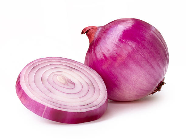 istock Single fresh peeled red or purple Spanish onion bulb with one onion slice in circle in stack isolated on white background with clipping path 2212917797