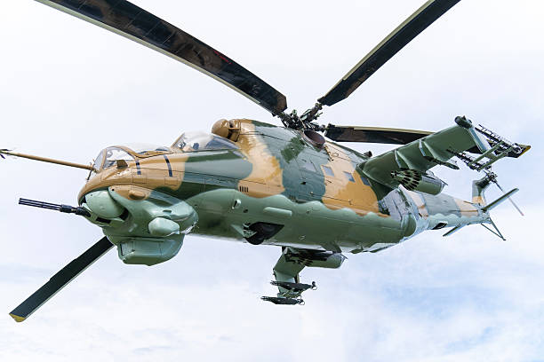 istock Camouflaged Soviet Mi-24 military attack helicopter in low flight 2212918383