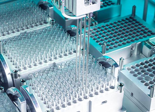 istock A close-up of an automated lab machine meticulously dispensing samples and solutions. 2212923959