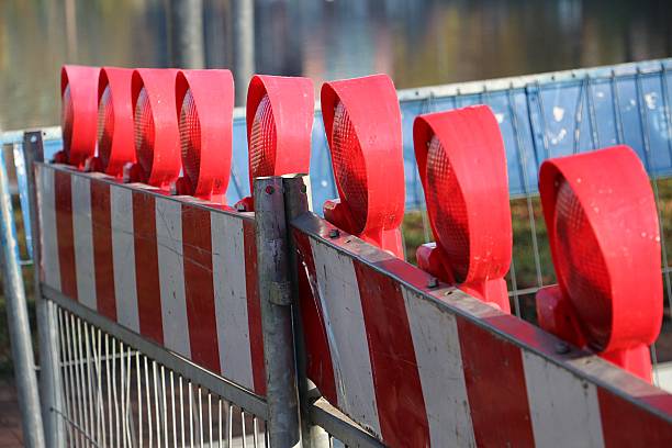 istock a close-up of a construction site barrier with warning lights 2212928323