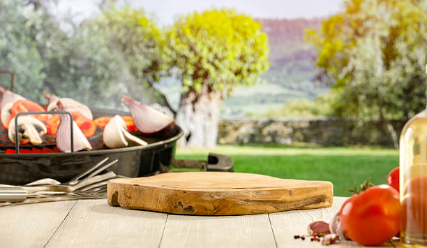 istock Barbecue Setup in Rustic Garden with Vegetables and Grill – Summer Picnic Concept. 2212932087