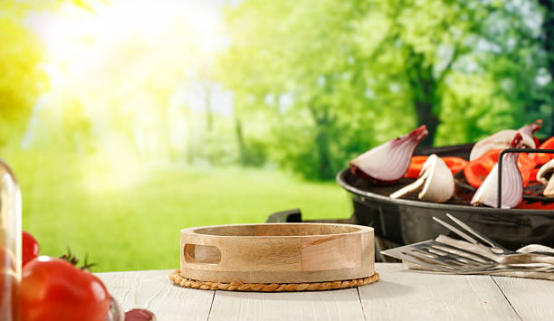 istock Barbecue Setup in Rustic Garden with Vegetables and Grill – Summer Picnic Concept. 2212932089