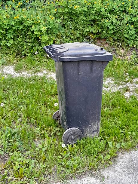istock Gray trash can in the garden 2212933810