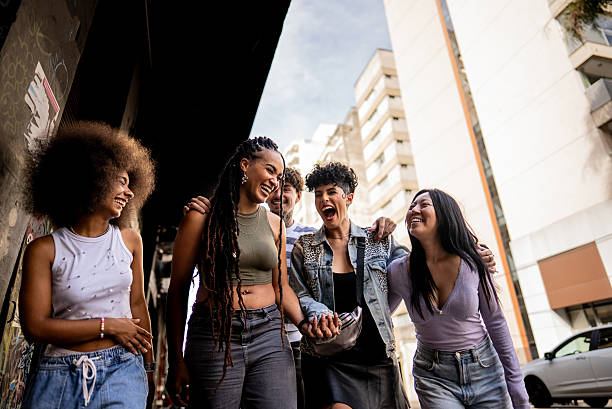 istock Friends talking and walking outdoors 2212934121