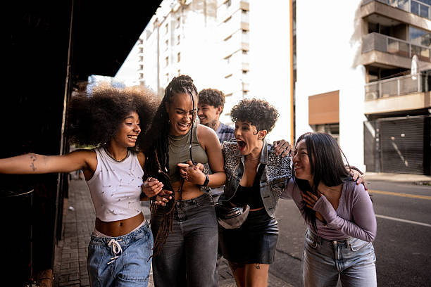 istock Friends talking and walking outdoors 2212934194