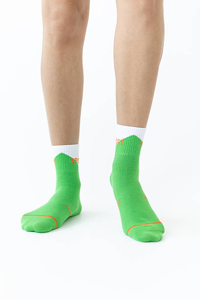 istock Green sports women's socks on a white background 2212935677