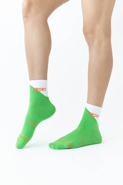 istock Green sports women's socks on a white background 2212935765