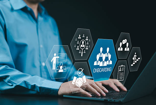 istock Onboarding new employee process concept. A businessman using laptop with icons representing onboarding process, training, recruitment, communication, hiring, development, and employee integration. 2212936004
