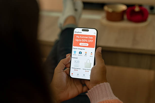 istock Woman relaxing on sofa using shopping app on smartphone 2212938383