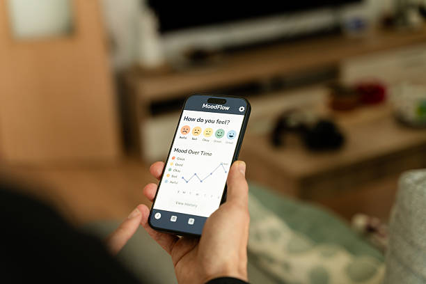 istock Person using mood tracker app on smartphone at home 2212938698