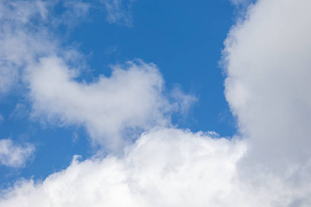 istock White clouds drifting across a vibrant blue sky 2212939834
