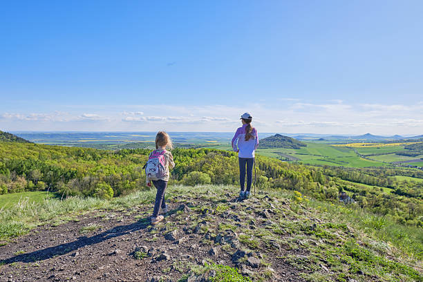 istock Children Enjoying Scenic Mountain Viewpoint 2212940177