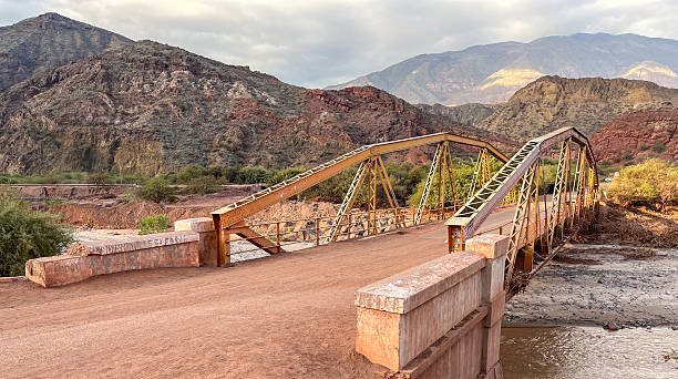 istock An ancient bridge over the river in a mountain landscape in Argentina 2212942132